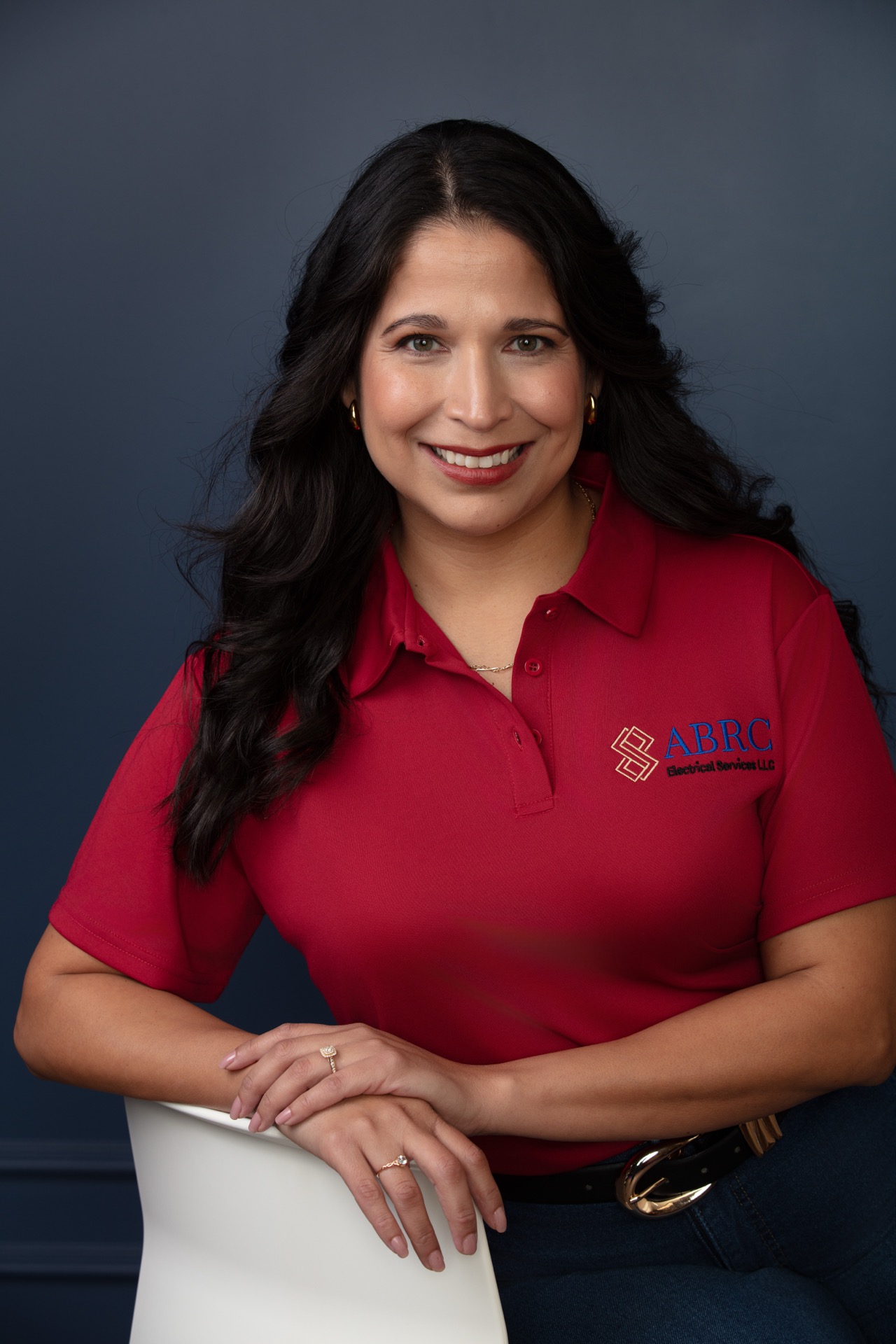 Corporate headshot, navy backdrop