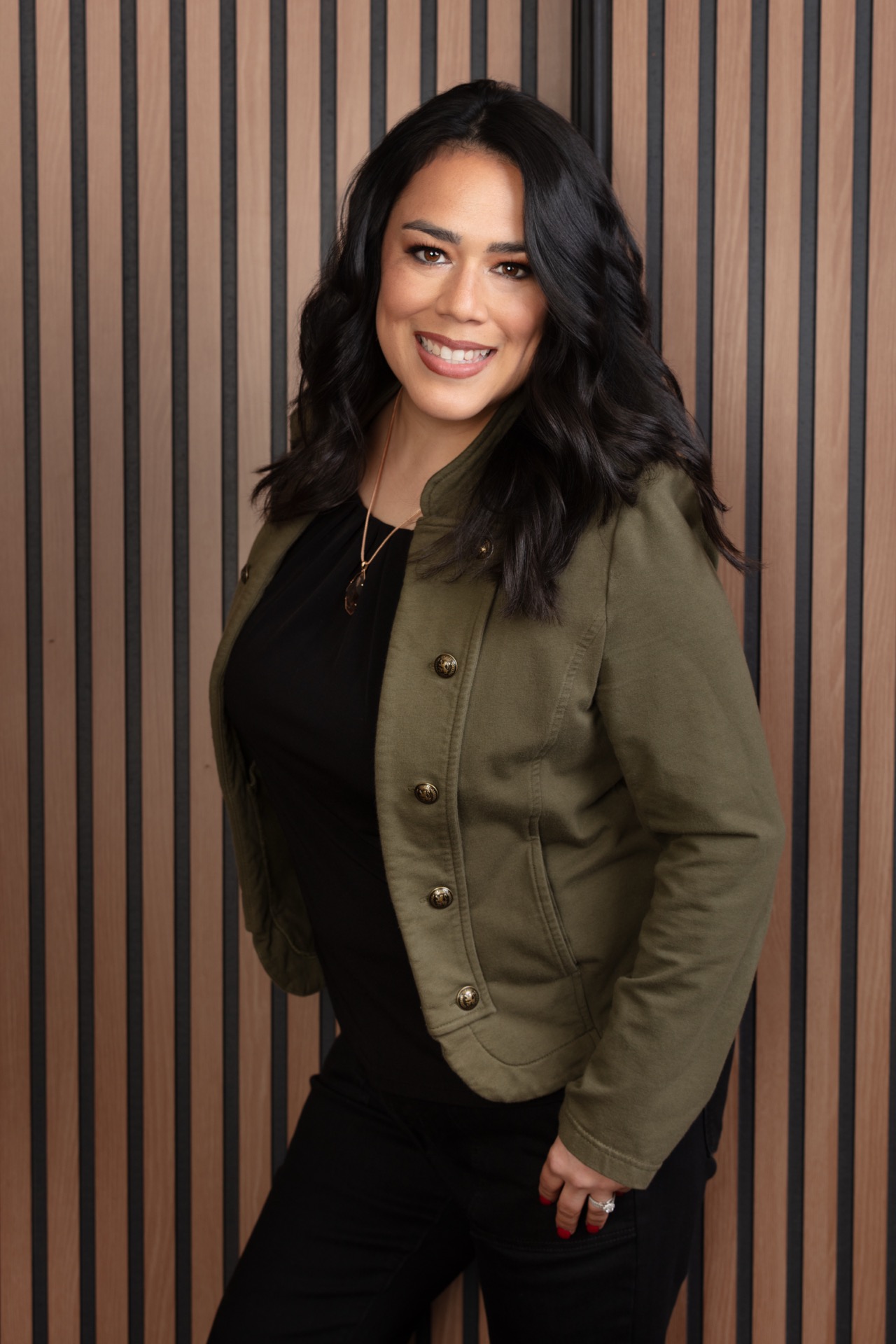 Professional studio headshot, wood slat backdrop